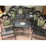 A verdigris patinated eleven piece garden suite of woven form comprising three tables, two