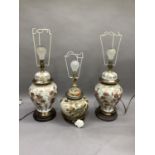 Three reproduction Japanese style baluster table lamps and shades, modern