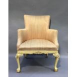 A George III style upholstered tub chair with tall back, upholstered arms and stuffed over seat,