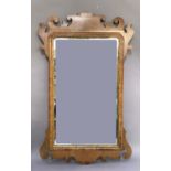 A reproduction mahogany veneered Vauxhall fretted frame wall mirror with gilt slip, 102cm wide