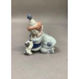 A Lladro figure, Pierrot with puppy and ball, 12cm high with certificate and original box
