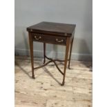 An Edwardian boxwood strung mahogany envelope top card table, conventional design, the frieze fitted