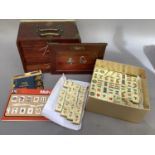 A Mah Jong set in carrying case fitted with drawers together with original instruction booklet (