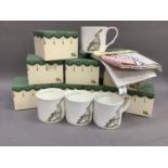 A quantity of 'Two Bad Mice' mugs, boxed, together with a 'Two Bad Mice' apron