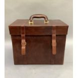 A brown leather document case, the lid with carrying handle, two divisions internally, 39cm x 26cm