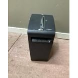 A Fellowes model P-58CS paper shredder