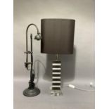 Two modern table lamps, one with oval brown shade the other lacking glass shade