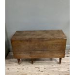 An oak drop leaf table on square and tapered legs, 120cm wide