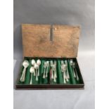 A wooden cutlery box with hinged lid, brass handle, 52cm wide together with a quantity of silver