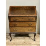 A reproduction mahogany bureau in George III style, outlined throughout with satinwood, boxwood