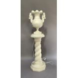 A reproduction alabaster segmental table lamp on barley twist stand, 99cm high