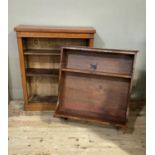 A Victorian mahogany bookcase, the rectangular top above shallow frieze and three adjustable