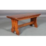 A late 19th/early 20th century stained pine table, possibly American, rounded rectangular top on