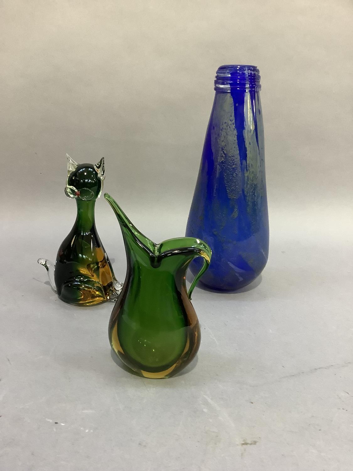 A Murano green and amber glass cat, 18.5cm high, a Murano green and amber glass jug, 17cm and a