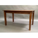 An oak kitchen table, rectangular, on square tapered legs, 132cm x 86cm