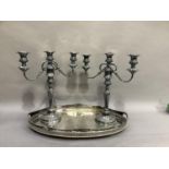 A silver plated oval two handled gallery tray together with a pair of silver plated two branch