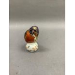 A Royal Crown Derby kingfisher paperweight, gold button, 11cm high