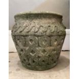 A concrete garden vase of squat baluster form, a pair of handles, moulded vitruvian border above