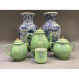 A Japanese green glaze tea service comprising teapot and cover, two handed sugar bowl and cover,