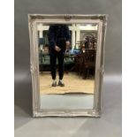A Victorian style silvered wall mirror, 106cm by 70cm