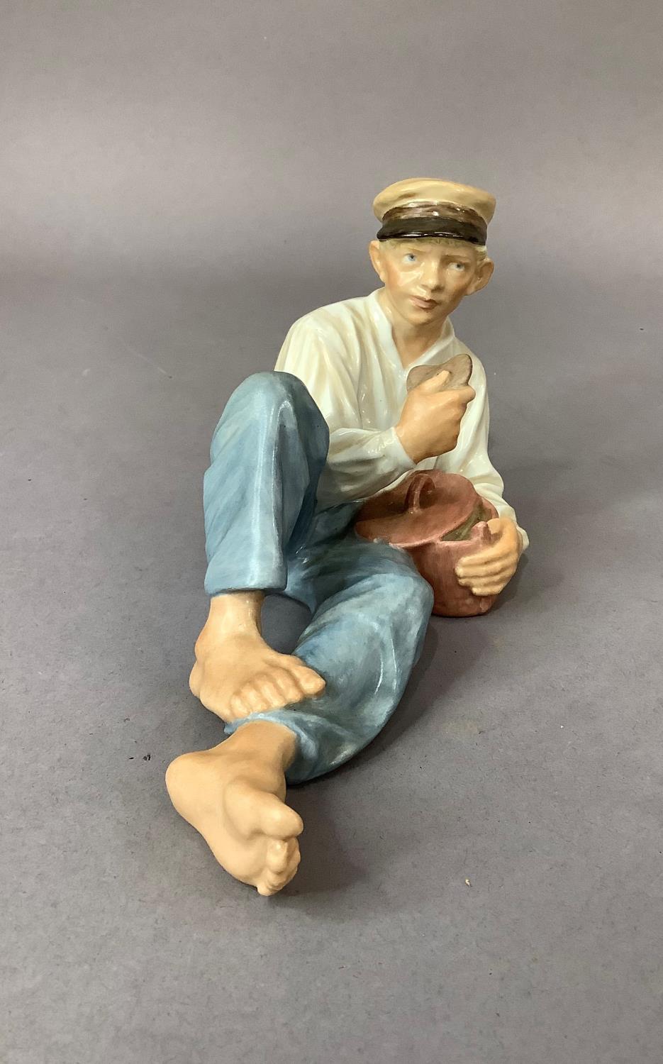 A Royal Copenhagen figure of a country boy resting as he eats his lunch, printed and underglaze blue - Image 2 of 3