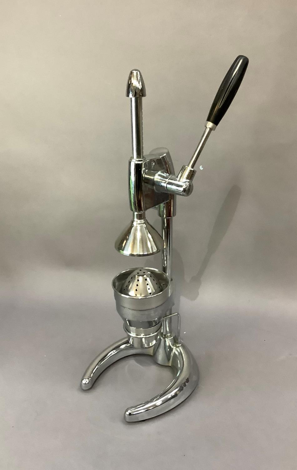 A chrome lemon squeezer, 60cm high