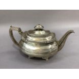 A George IV silver boat shaped tea pot, hinged lid with gadroon cast knop and lappet cast border,