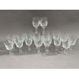 Eleven cut glass wines on knopped stems together with another set of six wines on knopped stems (17)
