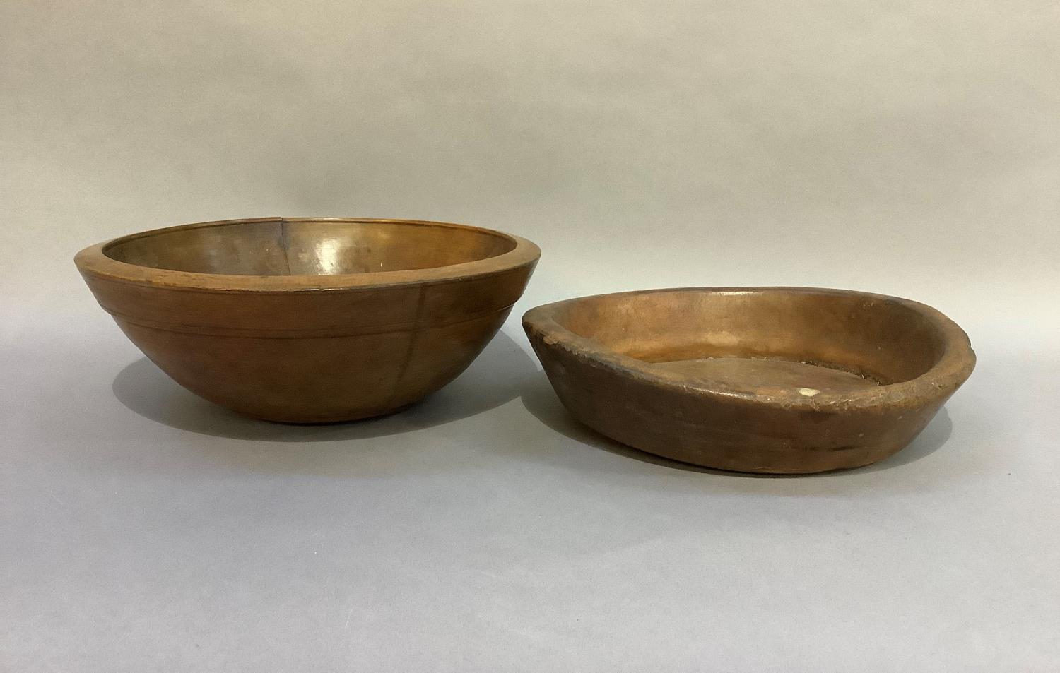 A 19th century circular sycamore bowl, 35cm diameter approx together with another turned wooden bowl