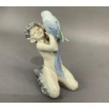 A Royal Copenhagen figure of a faun with a parrot, printed and underglaze blue mark to underside,