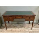 A Victorian mahogany desk, the rectangular top cross banded border inset with a gilt tooled green