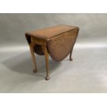 A mahogany drop leaf table on cabriole legs with pad feet, 100cm wide
