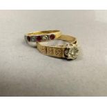 A ruby and diamond set band ring in 18ct yellow and white gold alternatively set with circular