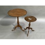 A George III mahogany tripod table, the circular top with moulded lip above baluster column on three