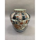 A 19th century baluster vase decorated in Imari palette, with flowers and leafage beneath formal