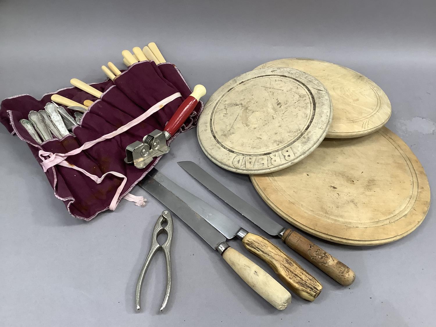 Three circular bread boards and knives and a quantity of silver plated ware, etc