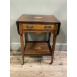 A late Victorian boxwood strung rosewood veneered two tier table, the rectangular top inlaid with