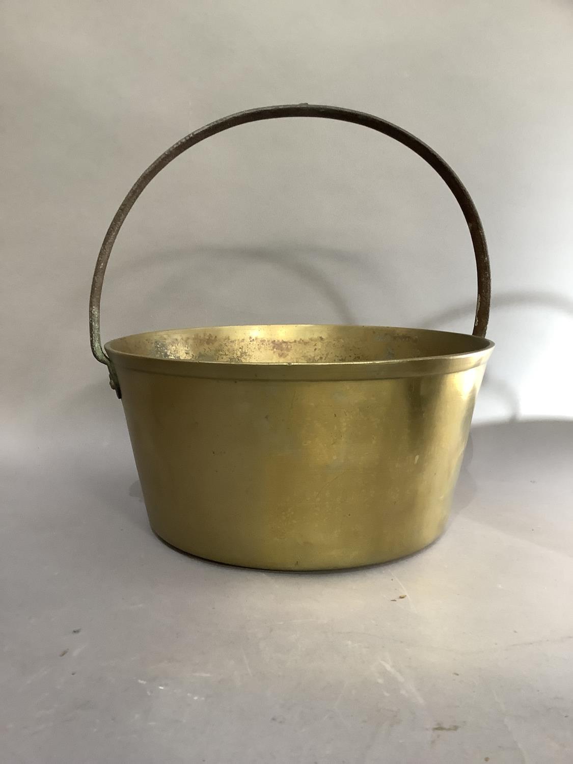 A large brass preserve pan with iron hoop handle, 32.5cm