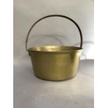 A large brass preserve pan with iron hoop handle, 32.5cm