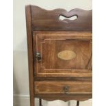 A mahogany night cupboard, George III style, the upper section with serpentine shaped pierced