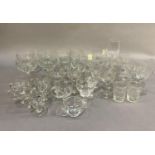 A quantity of Victorian and Edwardian table glass to include slice cut and acid etched wines,