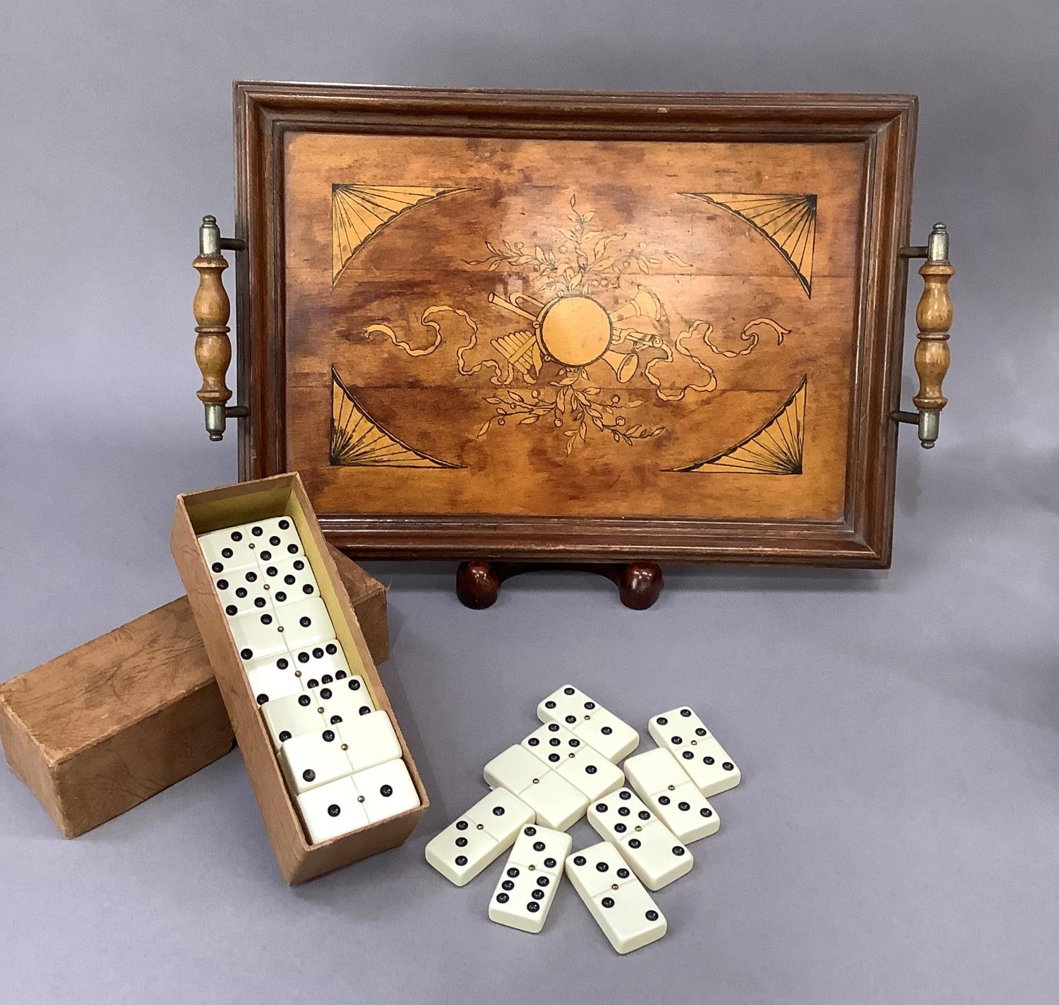An Edwardian two handle rectangular tray, the field inlaid' painted and decorated with musical