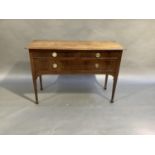 A mahogany chest, the rectangular top above two short and one long cockbeaded drawer on square