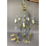 A vintage gilt metal and pressed glass chandelier with five branches together with a pair of