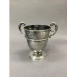 A George V silver two handled trophy cup on circular foot, engraved inscription Tidworth R.A.T.A