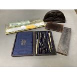 A cribbage board, a Hemmi vectolog slide ruler, leather wallets, wooden box etc