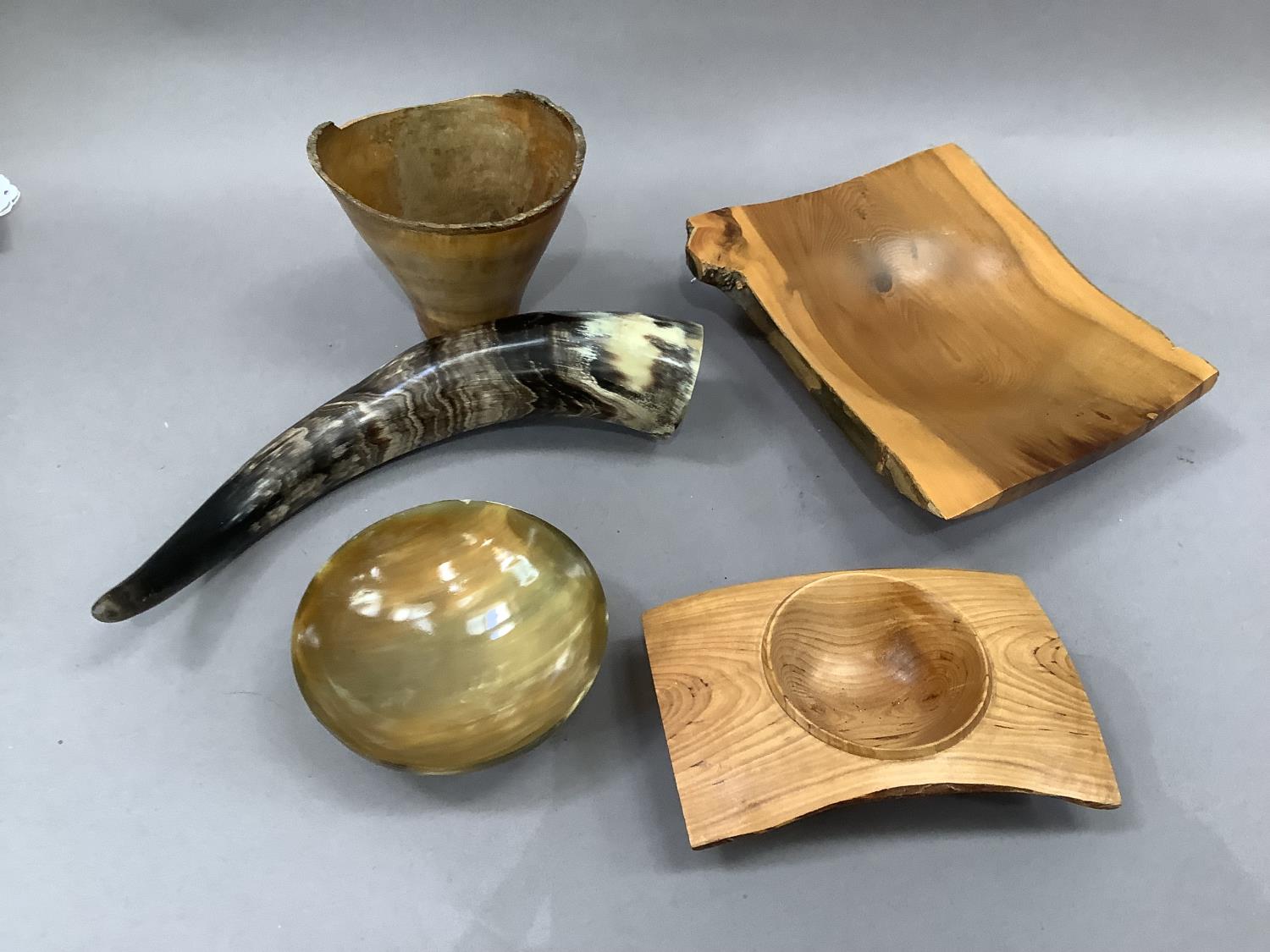 Three items of turned wood including vase and two dishes together with a cow horn and cow horn bowl