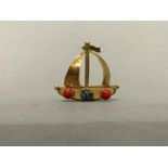 A mid 20th century ship brooch claw set with simulated coral and turquoise in 18cl golf, 25mm x