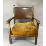 A beech childs chair with brown rexine close nailed concave back, on square legs, with brown