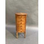 A reproduction mahogany stained beech cylindrical chest of six drawers on angular cabriole legs, the